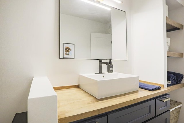 bathroom featuring vanity and hardwood / wood-style floors