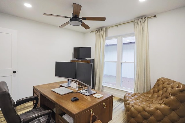 office area with hardwood / wood-style floors and ceiling fan
