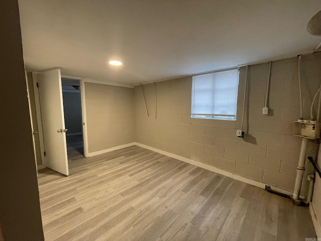 basement featuring light wood-type flooring