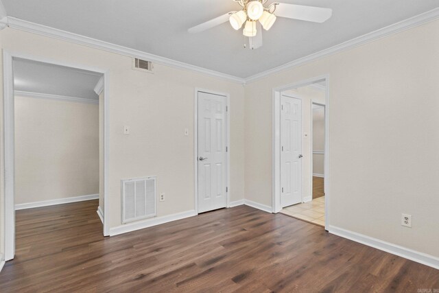 1601 N Bryant St Unit C27, Little Rock, AR 72207 - unfurnished bedroom featuring dark wood-type flooring, ceiling fan, and crown molding