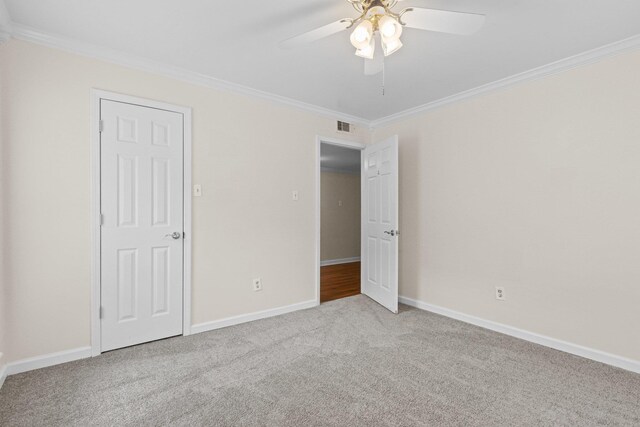 1601 N Bryant St Unit C27, Little Rock, AR 72207 - unfurnished bedroom with crown molding, light carpet, and ceiling fan
