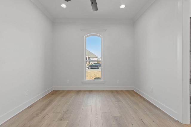 unfurnished room featuring light wood finished floors, ceiling fan, baseboards, and crown molding