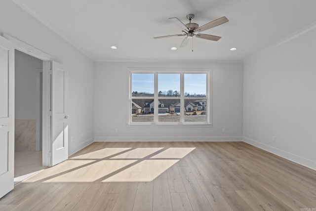 spare room featuring baseboards, crown molding, recessed lighting, and light wood-style floors