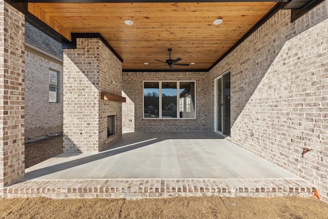 view of patio / terrace featuring an outdoor fireplace and a ceiling fan