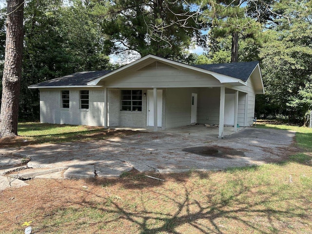 ranch-style home with a carport