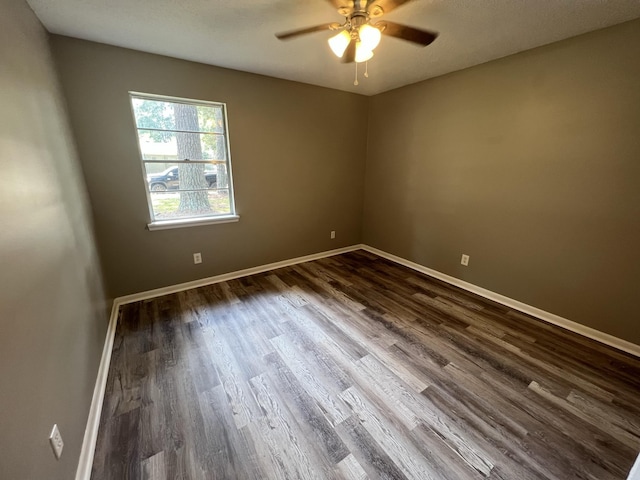 empty room with hardwood / wood-style flooring and ceiling fan