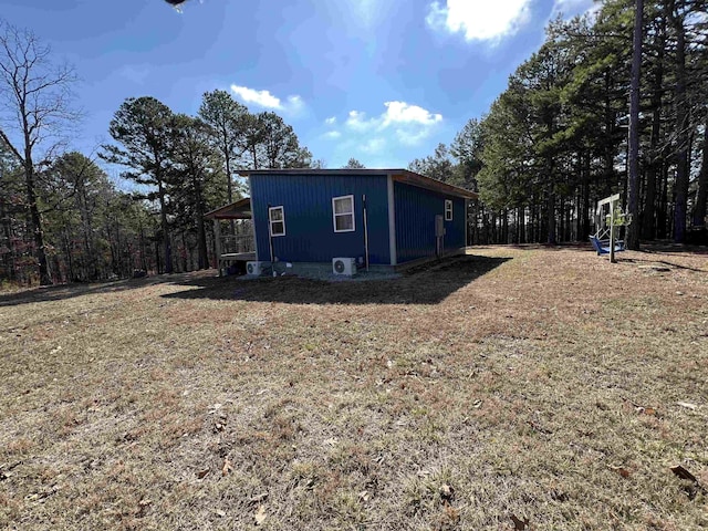 view of side of property with a yard