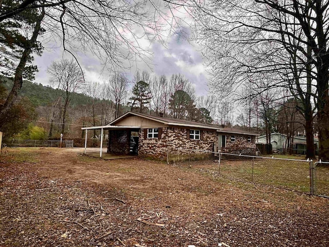 view of front of property with a carport
