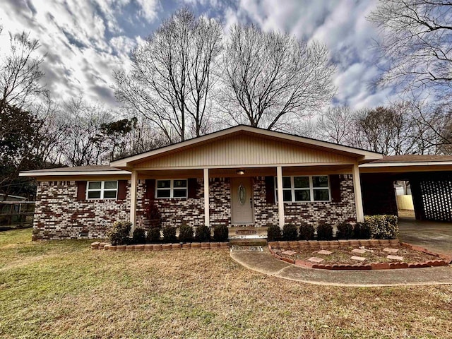 single story home featuring a front lawn and a carport