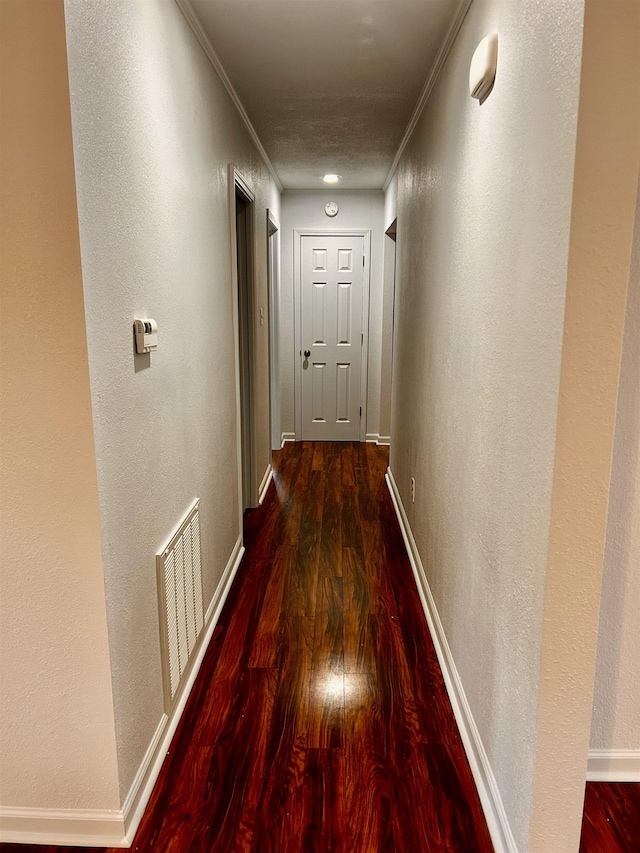 hall featuring crown molding and wood-type flooring