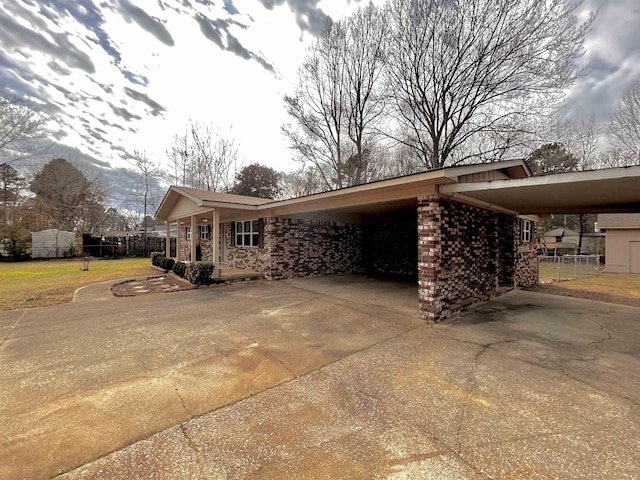 view of home's exterior with a carport