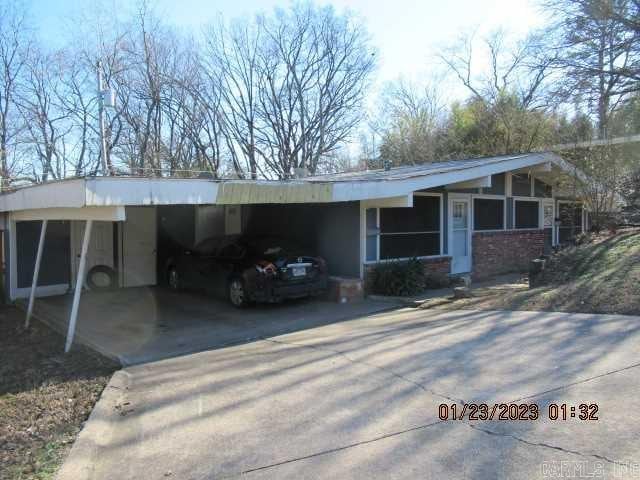 ranch-style home with a carport