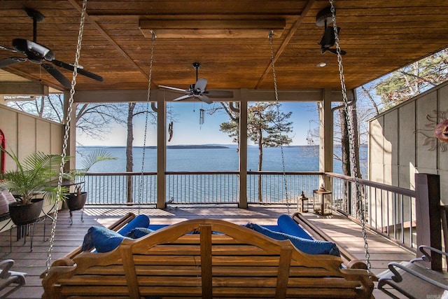 exterior space featuring a water view, ceiling fan, and outdoor lounge area