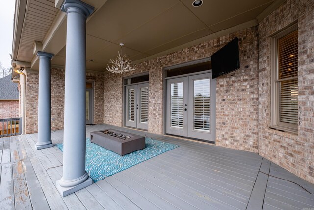 5 Deauville Cir, Little Rock, AR 72223 - deck with french doors and an outdoor fire pit