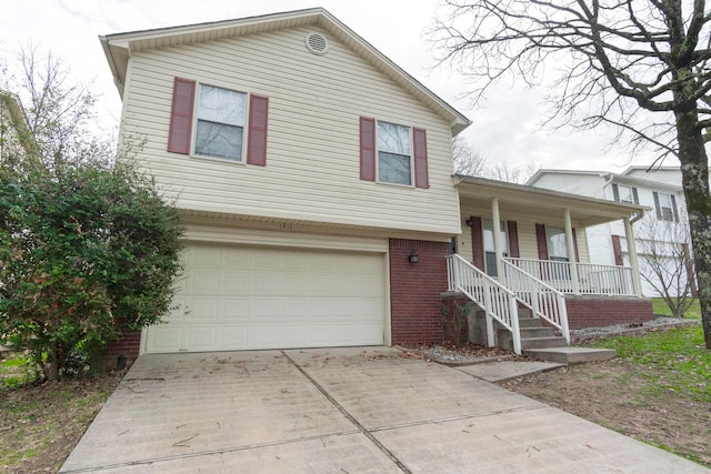 view of front of house with a garage and covered porch