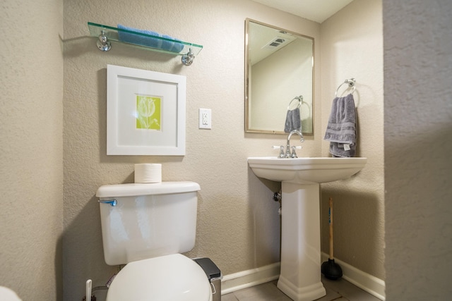 bathroom featuring toilet