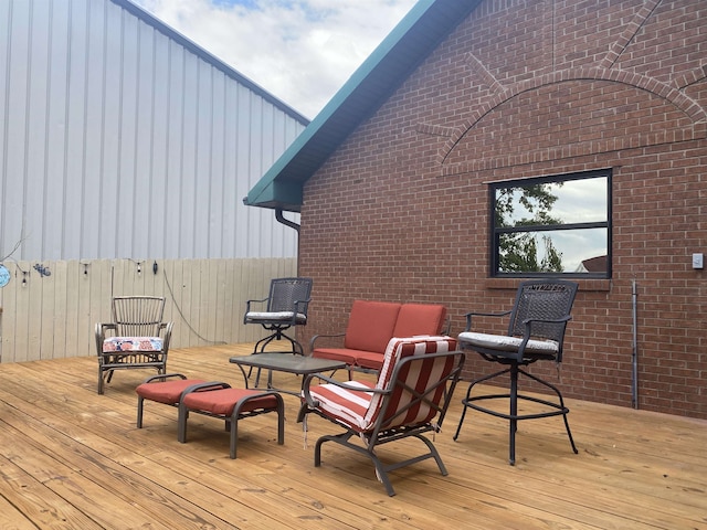 wooden deck with outdoor lounge area