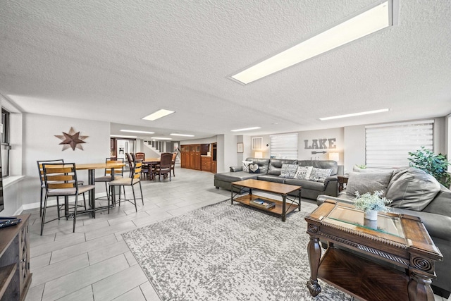 living room featuring a textured ceiling