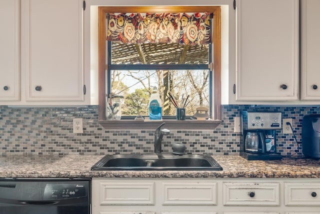 kitchen featuring white cabinetry, dishwasher, sink, and backsplash