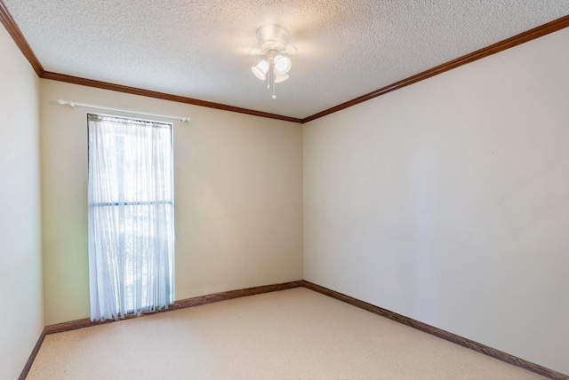 carpeted empty room with ceiling fan, crown molding, and a textured ceiling