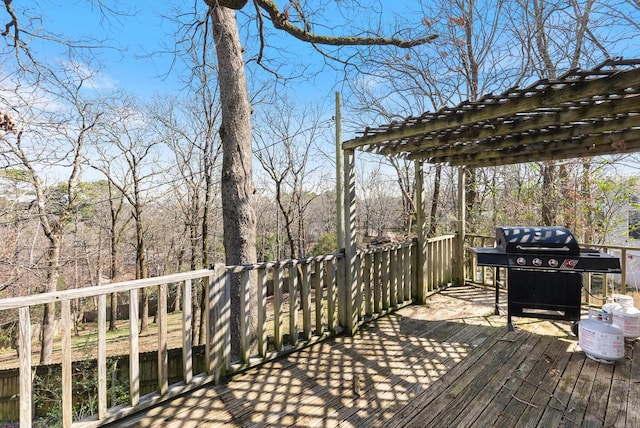 wooden terrace featuring a grill