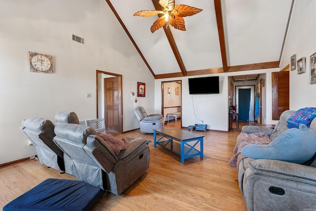 living room featuring ceiling fan, beam ceiling, high vaulted ceiling, and light hardwood / wood-style flooring