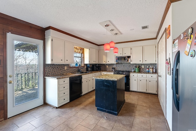 kitchen featuring stainless steel appliances, a center island, light stone counters, white cabinets, and decorative light fixtures