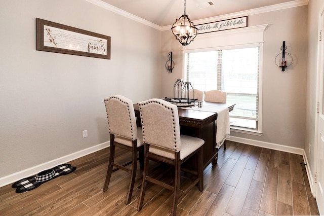 dining room with an inviting chandelier, crown molding, plenty of natural light, and dark hardwood / wood-style floors