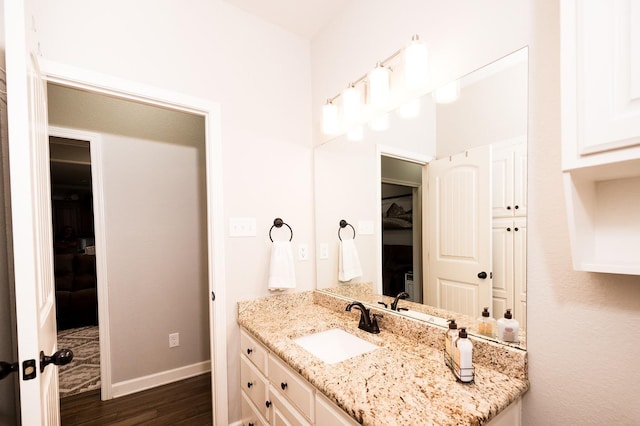 bathroom featuring vanity and wood-type flooring