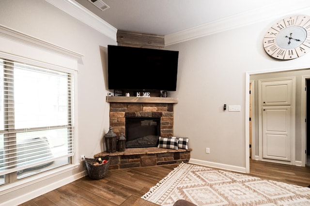 living room featuring ornamental molding, a fireplace, and hardwood / wood-style floors