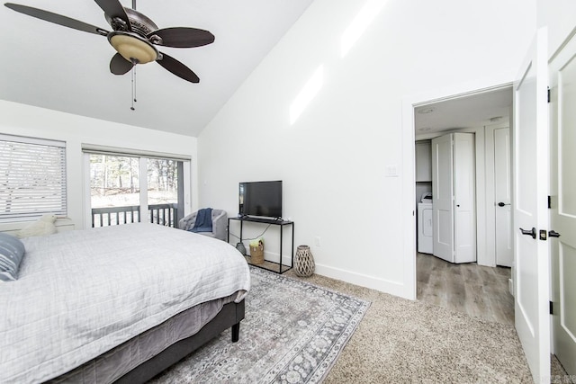 bedroom featuring ceiling fan, light colored carpet, high vaulted ceiling, and washer and dryer