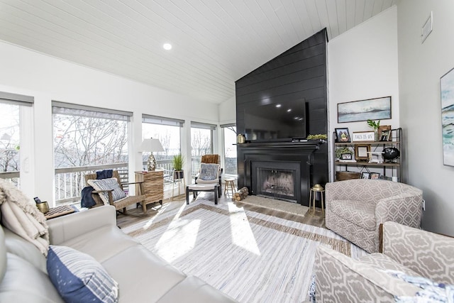 living room with high vaulted ceiling, a large fireplace, wooden ceiling, and light wood-type flooring