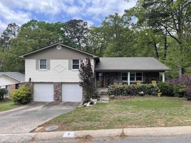 split level home featuring a garage, a porch, and a front yard