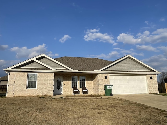 view of front facade featuring a garage and a front lawn