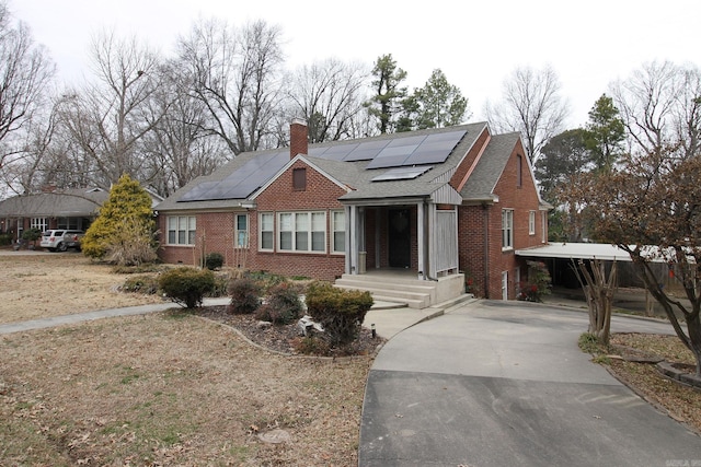 view of front of house featuring solar panels