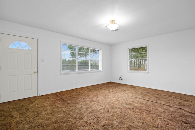view of carpeted entrance foyer