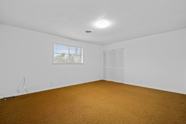 unfurnished room featuring carpet flooring