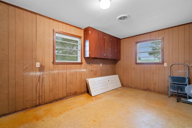 empty room featuring wood walls