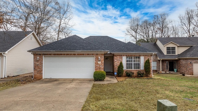 view of front of house with a garage and a front lawn