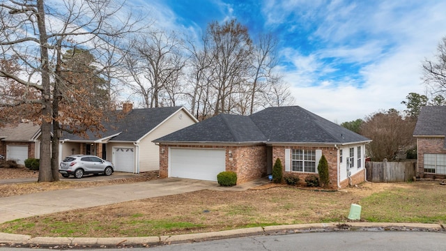 ranch-style house with a garage and a front yard