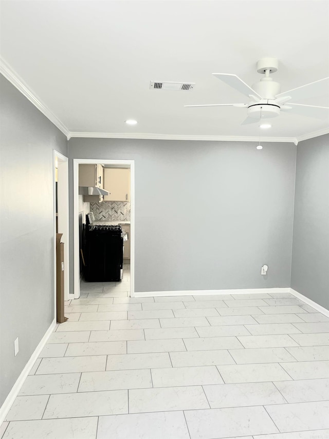 spare room with crown molding and ceiling fan