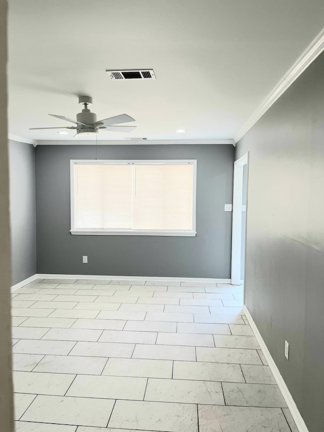 empty room featuring crown molding, plenty of natural light, and ceiling fan