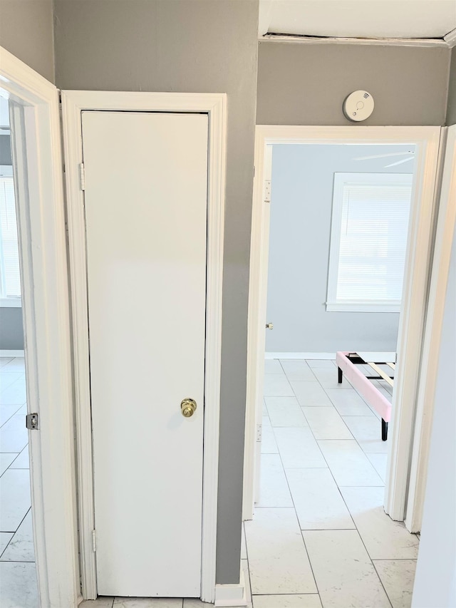 hallway with light tile patterned flooring