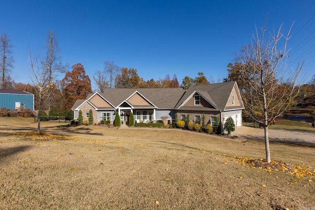 view of front of property with a garage and a front yard