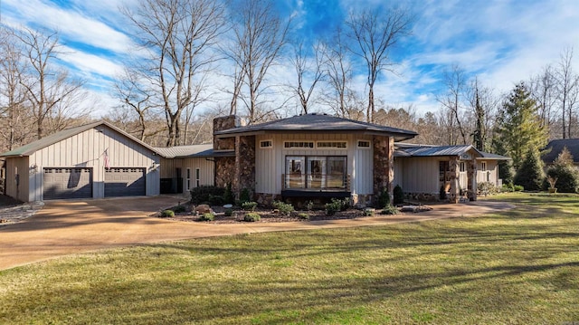 view of front of home with a garage and a front yard