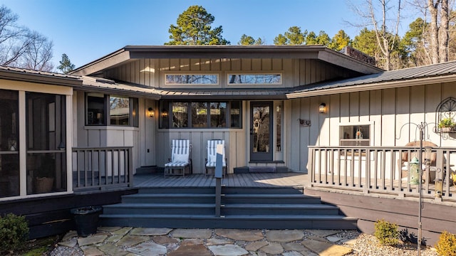 doorway to property with a wooden deck