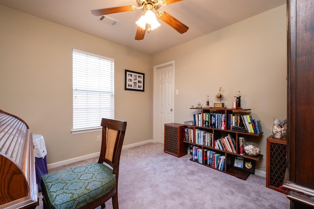 interior space with light colored carpet and ceiling fan