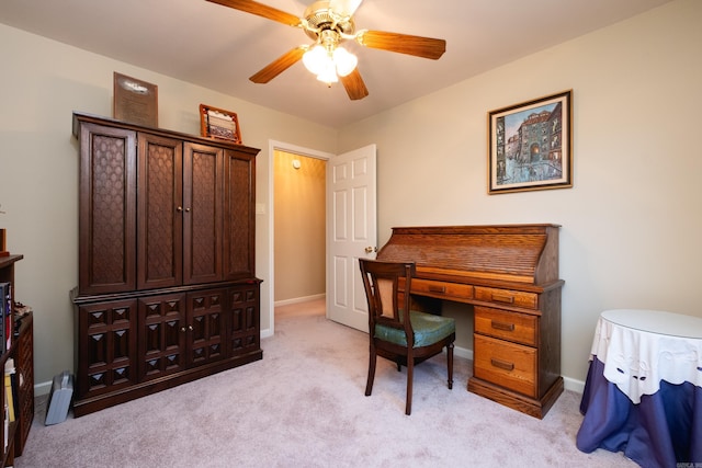 carpeted office with ceiling fan