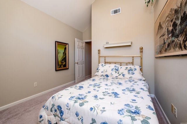 carpeted bedroom featuring high vaulted ceiling