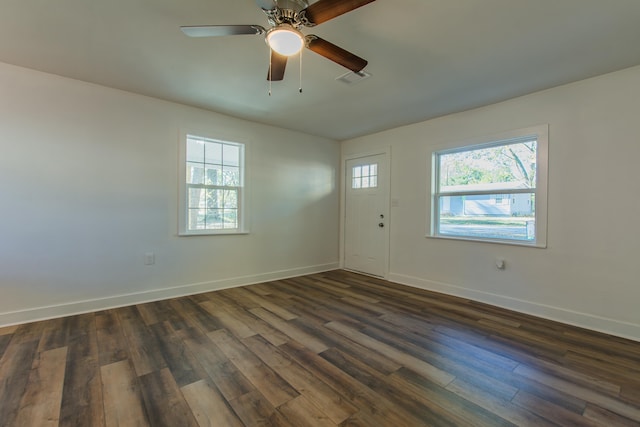 spare room featuring ceiling fan and dark hardwood / wood-style flooring